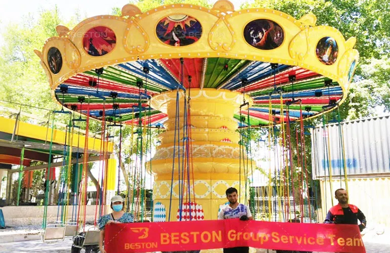 Цепочная карусель в парке «Гафур Гулям», Узбекистан